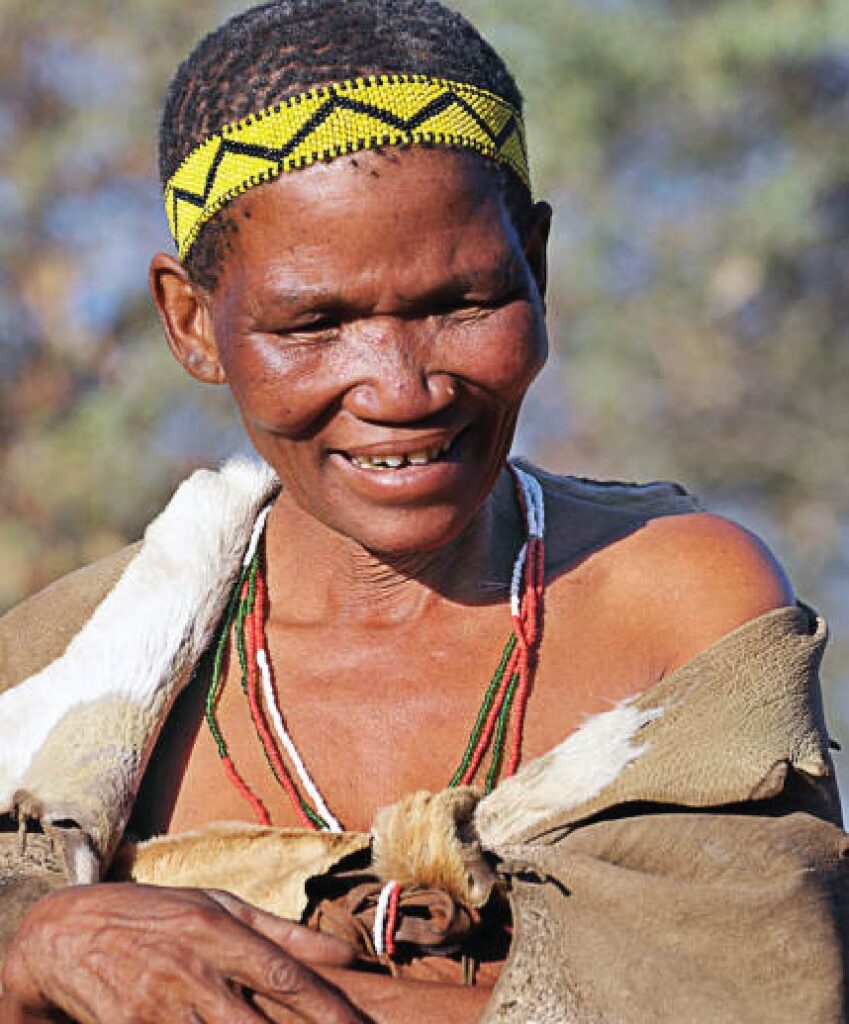 Traditional clothing and a patterned headband smilling woman